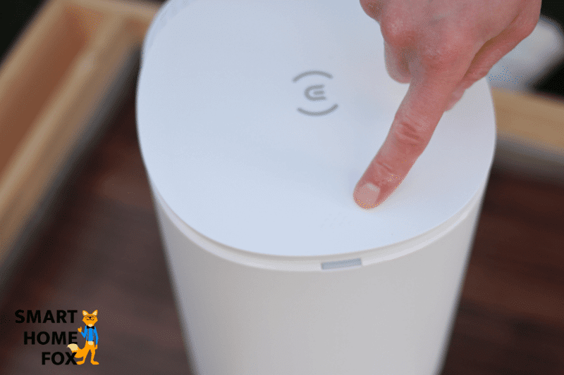 Opening the lid of the Ecovacs Deebot N8’s auto-empty-dock